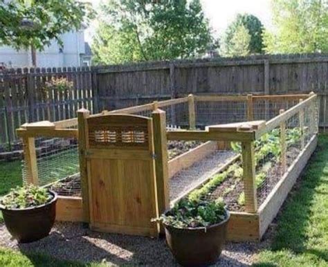 A block edged raised vegetable garden. How to build a RAISED AND ENCLOSED GARDEN BED. Step by step instructions with a video … in 2020 ...