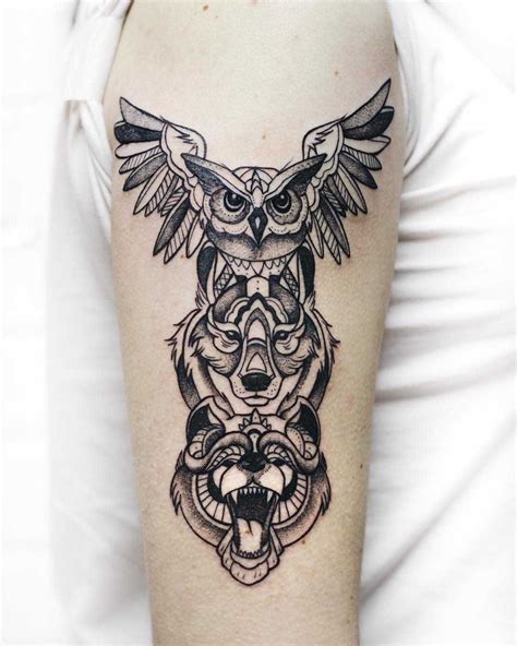 Animal spirit totem tattoo by Sasha Kiseleva inked on the right arm