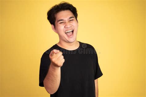 Man Opens Mouth Wide While Laughing With Fingers Pointing Stock Photo