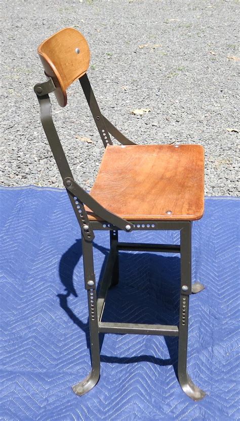 Bend plywood to create a functional and aesthetically pleasing piece of furniture. Industrial Bent Plywood Chair Adjustable For Sale at 1stdibs