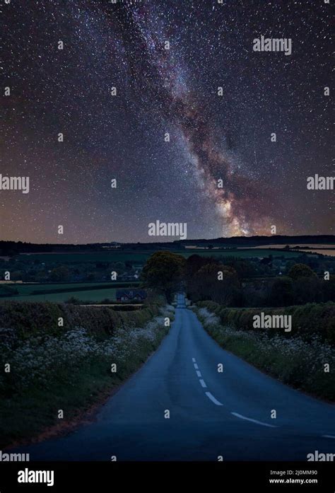 Stunning Vibrant Milky Way Composite Image Over Landscape Of Empty Road