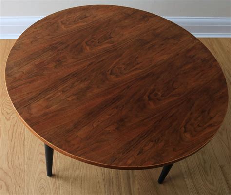 There are a lot of marks to the wood & some lighter areas & a small area of blistering. A vintage Gordon Russell coffee table, circa 1960s