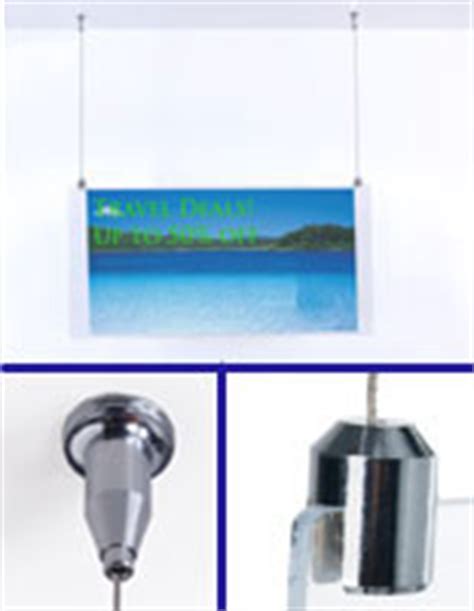 A picture hanging system consists of a hanging rail with hanging wires and hooks. Hanging Sign Kit - Nylon Wire