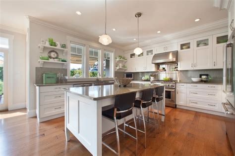 White kitchen cabinets with grey countertops don't need to be reserved for contemporary spaces. Quartz countertops - the eye catcher in every kitchen