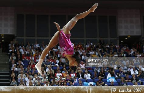 Us Gymnast Gabrielle Douglas Performs On The Beam During The Artistic