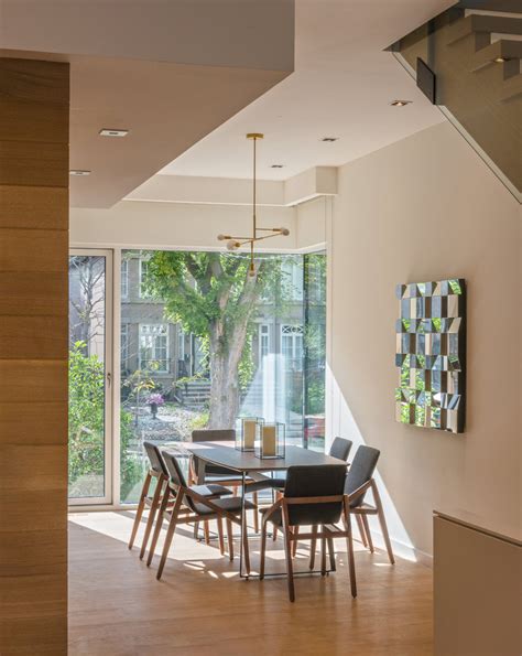 Emphasis on common area of ??happiness together. Narrow Semi-Detached House Features Modern Atrium Space ...