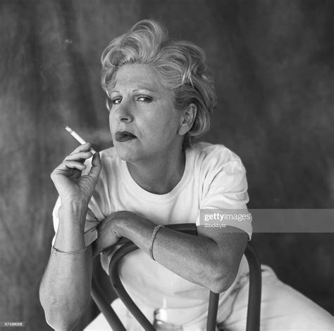 Portrait Of Arrogant Mature Woman Smoking A Cigarette High Res Stock