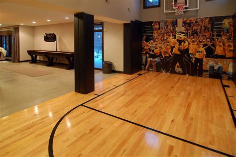 Our home basketball court 45' x 45' with 3 cut outs in the walls to create more room for the 3 hoops. Indoor/Outdoor Basketball Courts | Elizabeth Erin Designs