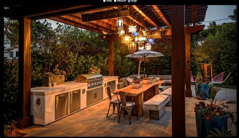 This is close up view of the patio, outdoor kitchen and dining area. BBQ area, lights | Outdoor kitchen decor, Outdoor pergola ...