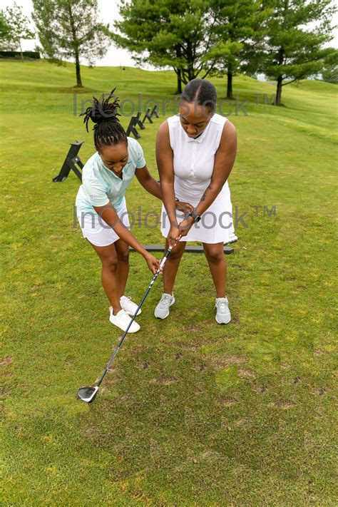 10 Black Female Golfer Instructing Black Female Golfer — Incolorstock