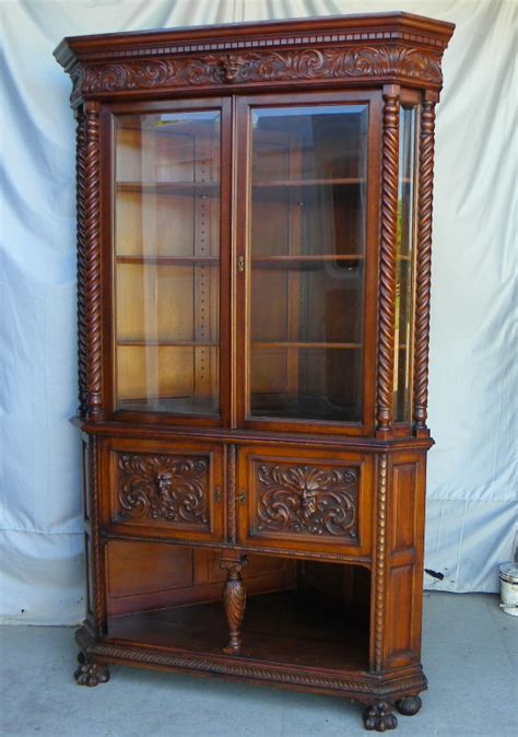 19th century mahogany corner cabinet features a beautiful golden brown finish, burlwood door fronts, ornate inlaid designs, split pediment top with finial, and inlaid corner accent cabinet features a split pediment top with finial, ornately inlaid floral designs, and antique brass capped legs. Bargain John's Antiques | Antique Victorian Quartered Oak ...