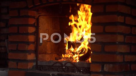 the fire burns in the brick fireplace 4k stock footage brick burns fire footage brick