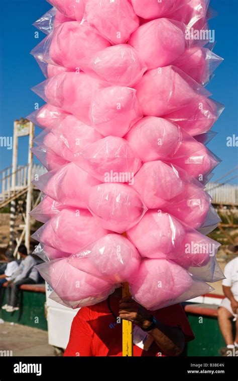 Mexican Vendor With Large Pole Of Pink Cotton Candy During Celebrations