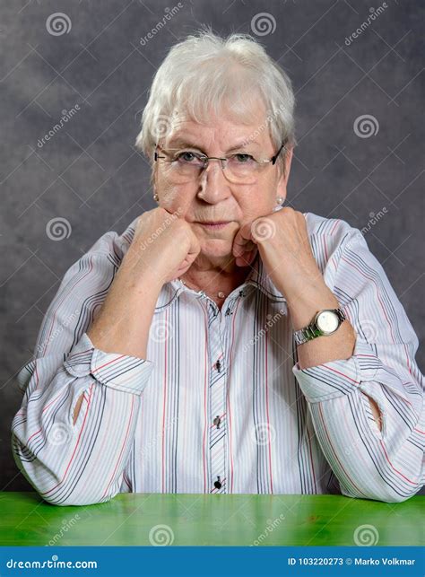 Gray Hairy Elderly Woman With Glasses Looking Serious Stock Image
