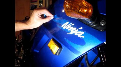 Working quickly and carefully, use your craft knife and/or tweezers to start pulling the vinyl away from the shirt. How to remove motorcycle decals - YouTube