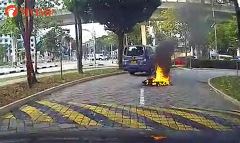 The fire was extinguished by members of the public using buckets of water before the scdf arrived. PMD catches fire while in use at Sengkang HDB block