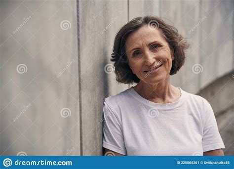 relaxed mature pretty active female standing outdoors stock image image of adult fitness