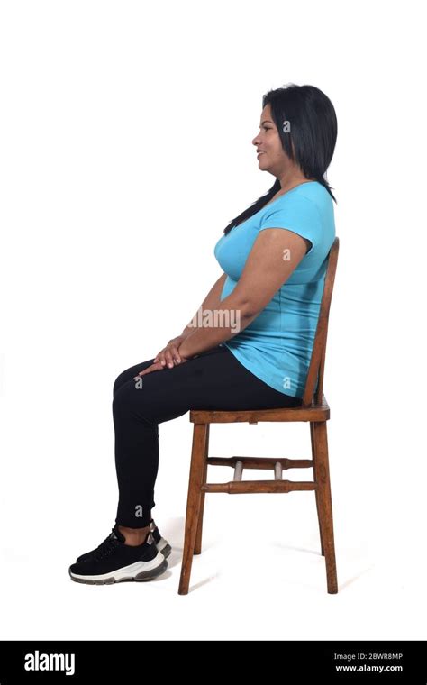 Portrait Of A Woman Sitting On A Chair In White Background Sideways