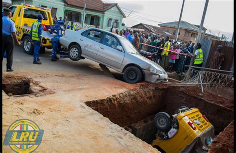 Keke Napep Falls Into Soakaway Pit After Accident With Car In Ikorodu