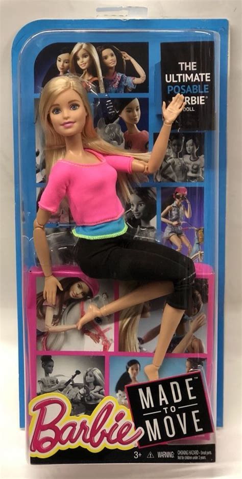 The Barbie Movie Doll Is Posed In Her Pink Shirt And Black Pants With An Open Mouth
