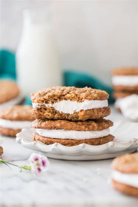 Two Oatmeal Cream Pies Stacked On Top Of Each Other On A White