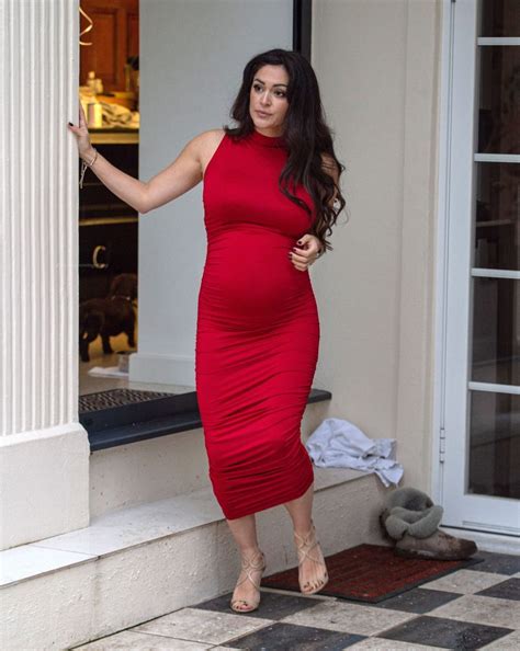 Casey Batchelor Shows Off Her Baby Bump In A Red Dress Photos