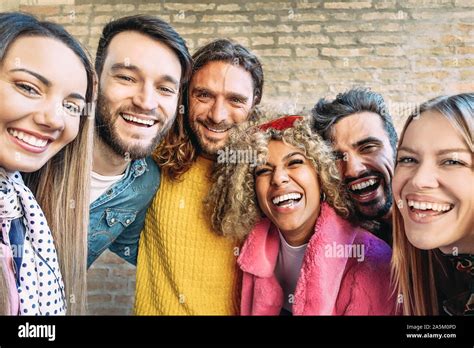Group Of Happy Friends Taking Selfie With Mobile Smartphone Outdoor