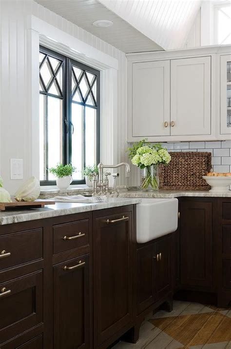 And these aren't just any kitchen cabinet paint colors, either — these are the colors that will really shine, hold up well over time, and add a bit white and a rich, dark gray are my favorite colors to use in a kitchen. Gorgeous kitchen features light grey upper cabinets and ...