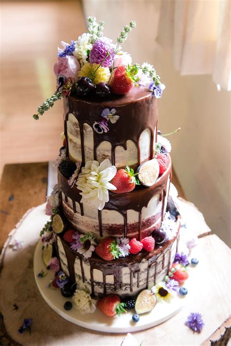 Unlike cornstarch or piping gel that leaves the surface after sometimes, this edible glue holds everything firmly for longer hours. an edible flower cake with melted chocolate in three tiers ...