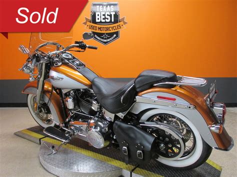 The heritage softail is a strong general purpose bike, with a big twin engine and styling designed to resemble a traditional hard tail chopper, with added long. 2014 Harley-Davidson Softail Deluxe - FLSTN for sale ...