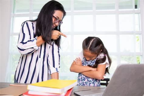 Premium Photo Teacher Scolding And Young Student Girl In The Class