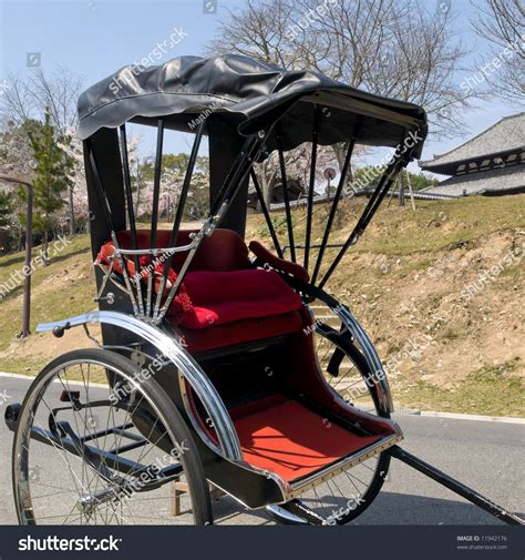 Traditional Two Wheeled Carriage That Is Drawn By A Runner Which Seats