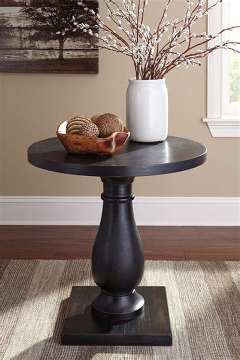 Casual Pedestal End Table In Vintage Black Mathis Brothers Furniture