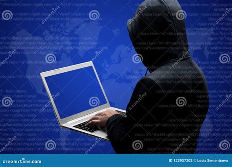 Anonymous Faceless Hacker In Black Clothing Stands Back Works On Code
