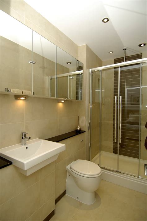 The idea of this ensuite bathroom is showing the elegant look with its white color and the modern accent. Concept Interiors