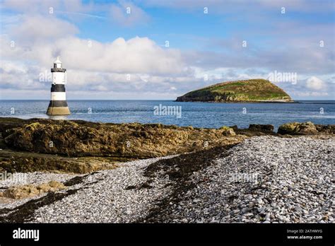 Penmon Lighthouse And Puffin Island Ynys Seiriol From Pebble Beach At