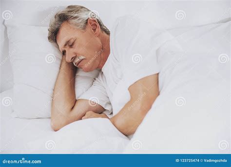 Old Man Sleeping In Comfortable White Bed At Home Stock Photo Image