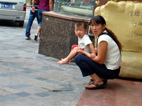 holding daughter pee