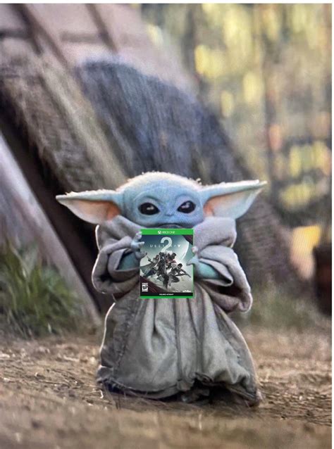 Baby Yoda Holding His Favourite Game In The Whole Galaxy Rdestiny2