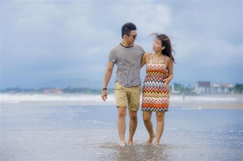 Young Beautiful And Asian Chinese Romantic Couple Walking Together