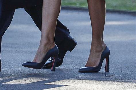 Melania Trump Wears Red Trench Coat Louboutin Heels To Mar A Lago Footwear News