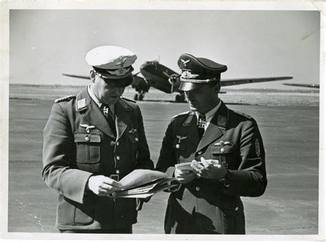 Two Luftwaffe Officers Looking Over Documents Eto October 1941 The