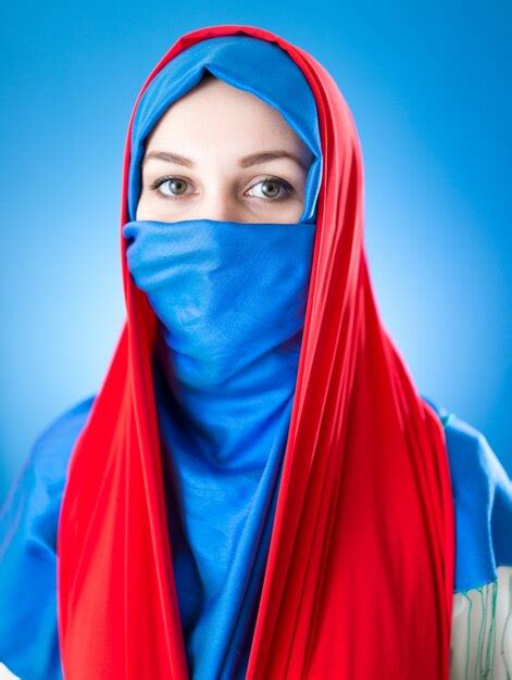 premium photo beautiful arabic girl with veil over blue background