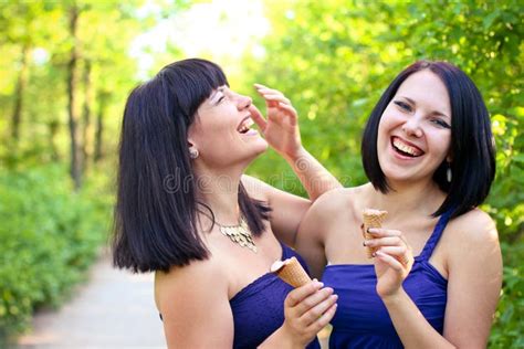 Two Laughing Women With Ice Cream In The Summer Park Stock Image Image Of Outdoor Green