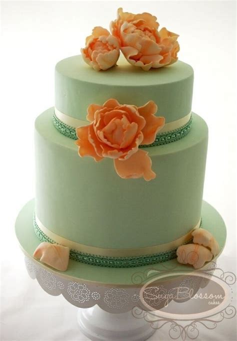 A Vintage Inspired Cake Iced In Mint And Topped With Handmade Peach