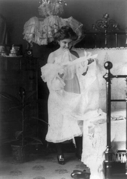 Posterazzi Woman Nightgown C1900 Na Woman Putting On A Nightgown
