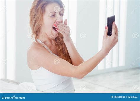 Last Selfie Before Bed Young Beautiful Woman Taking A Selfie On Her Phone In Bed Stock Image