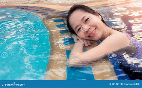 Asian Woman Relax And Smile In The Swimming Pool169 Style Stock Photo