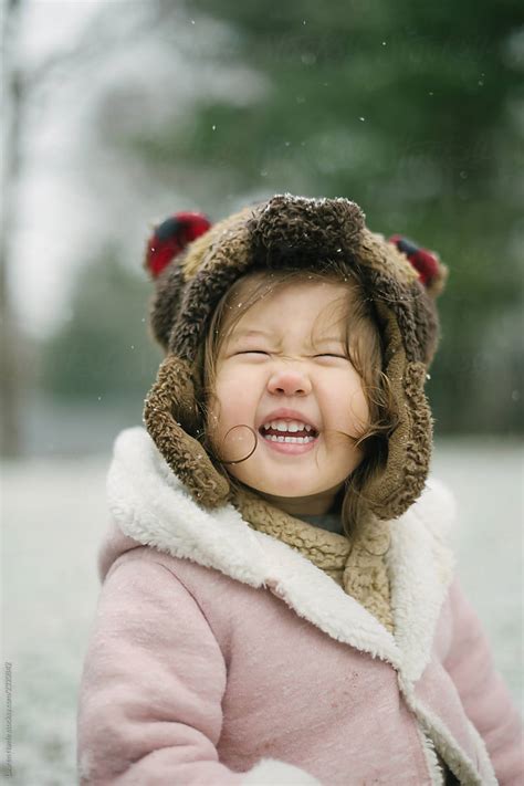 Portrait Of Happy Child In Snow Del Colaborador De Stocksy Lauren