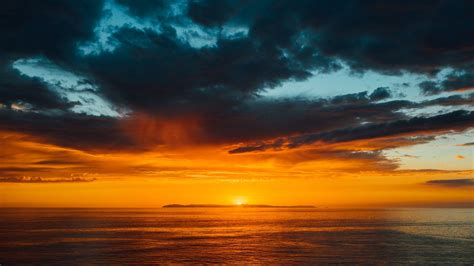 Download Wallpaper 1600x900 Sea Horizon Sunset Clouds Sun Sky